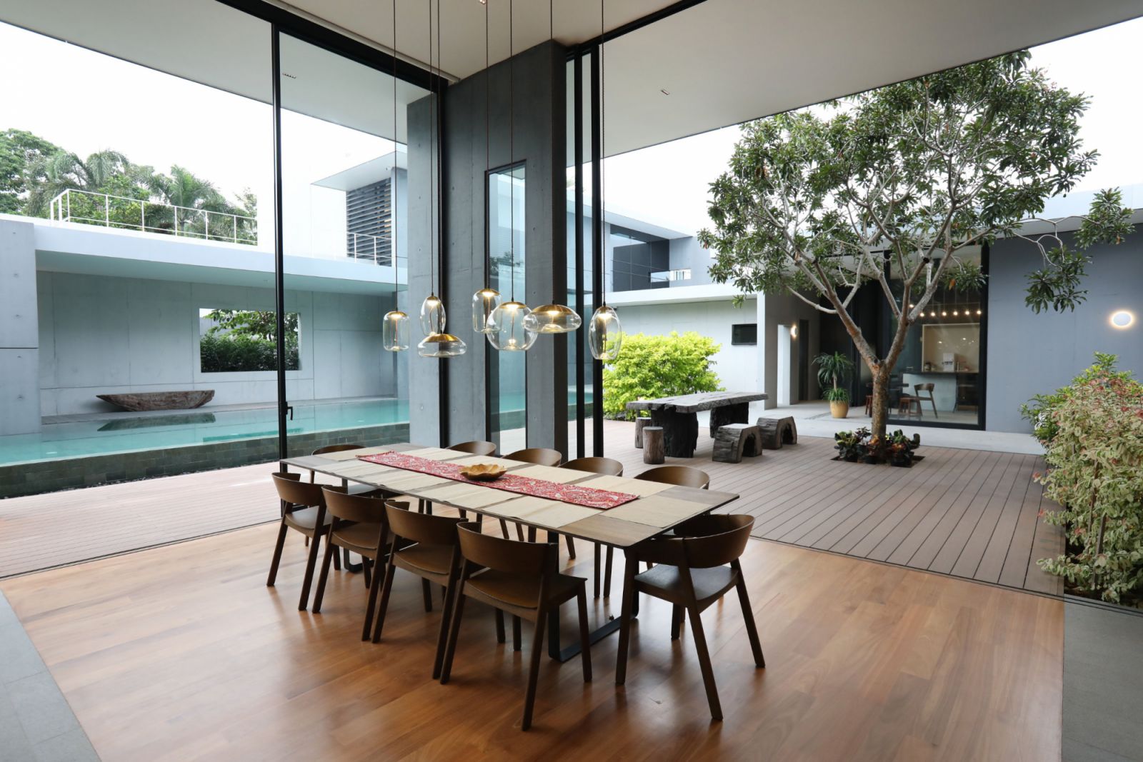 Hanging lights create a sculpture of sorts in the dining area