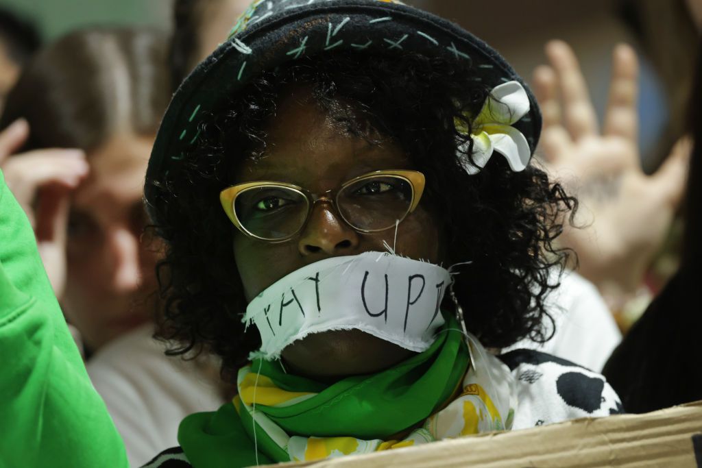 BAKU, AZERBAIJAN - NOVEMBER 23: Activists, including one with her mouth taped over with the words: "Pay Up", protest for climate finance grants for poor countries on day twelve at the UNFCCC COP29 Climate Conference on November 23, 2024 in Baku, Azerbaijan. The COP29, which was scheduled to end yesterday, has gone into overtime, with parties meeting and deliberating over the text of the final agreement following heavy criticism by a wide array of delegates of earlier drafts. The COP29 is bringing together s