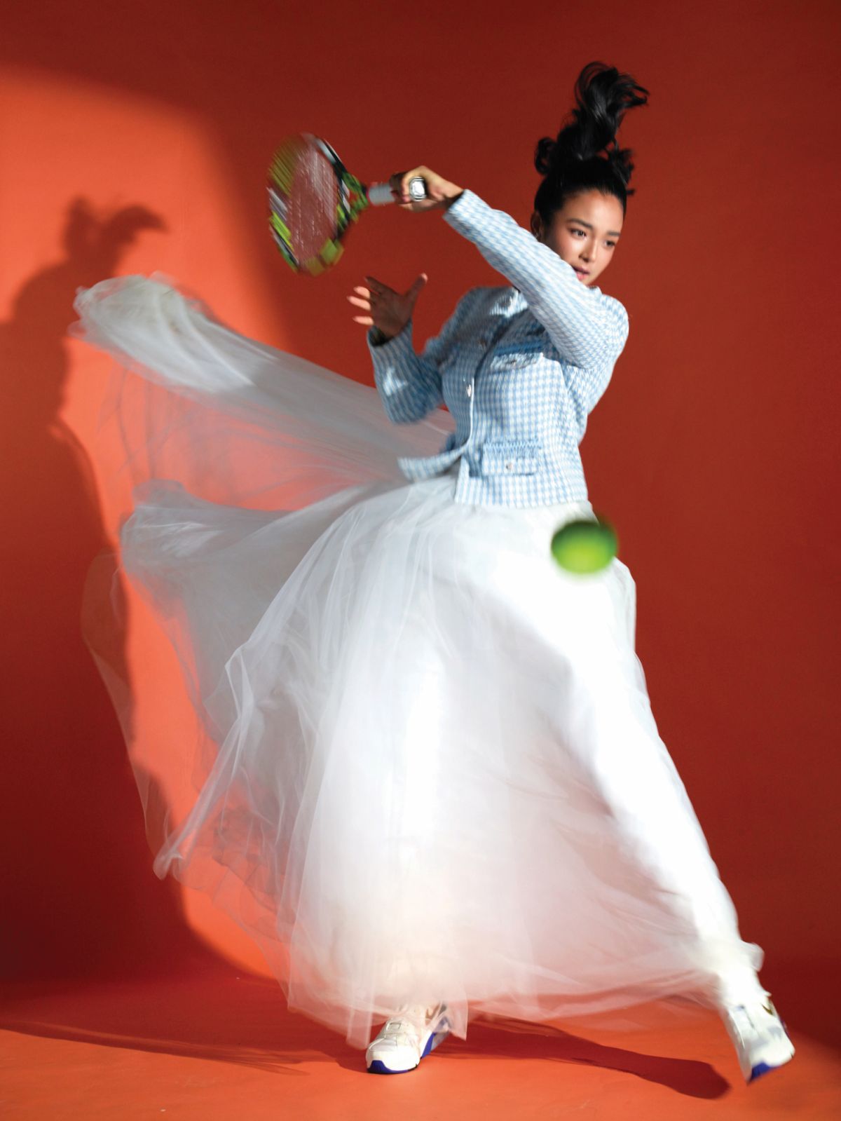 Alex Eala wears a Mark Bumgarner jacket, Mara Chua tulle skirt, Love Rocks earrings and Nike shoes from Commonwealth