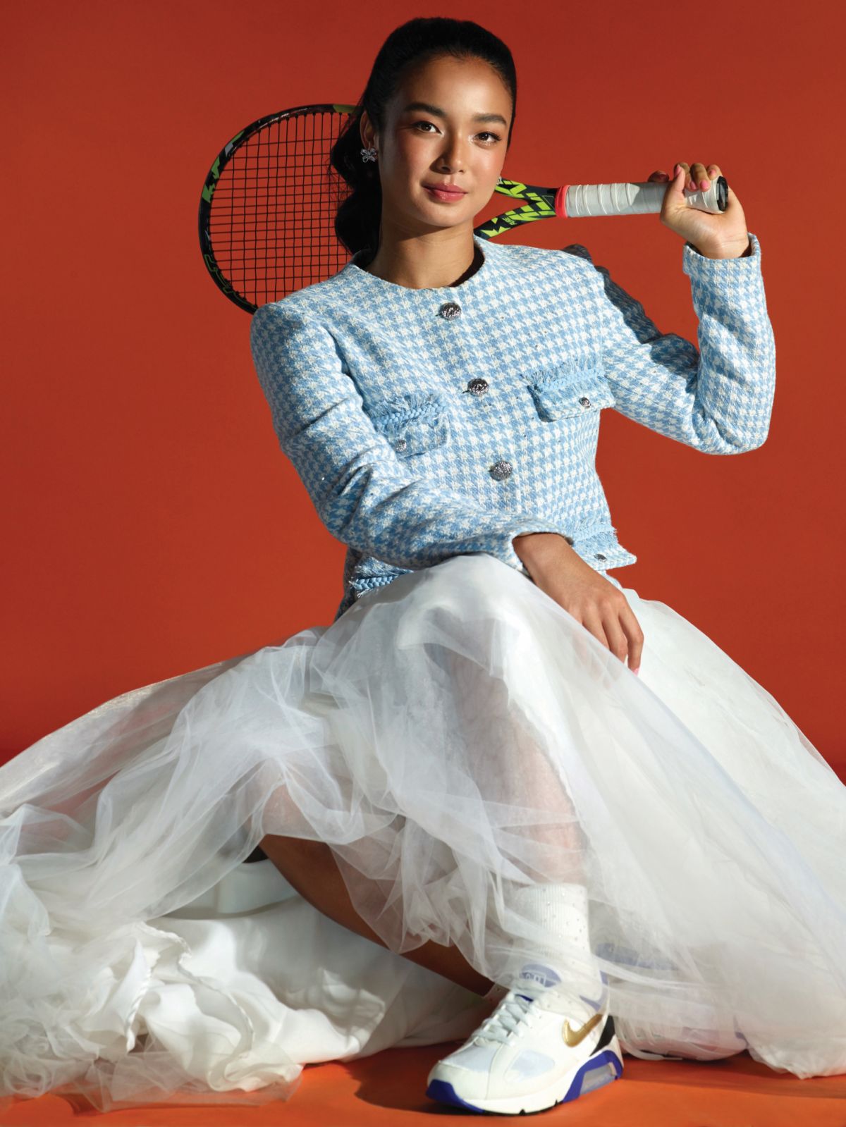 Alex Eala wears a Mark Bumgarner jacket, Mara Chua tulle skirt, Love Rocks earrings and Nike shoes from Commonwealth