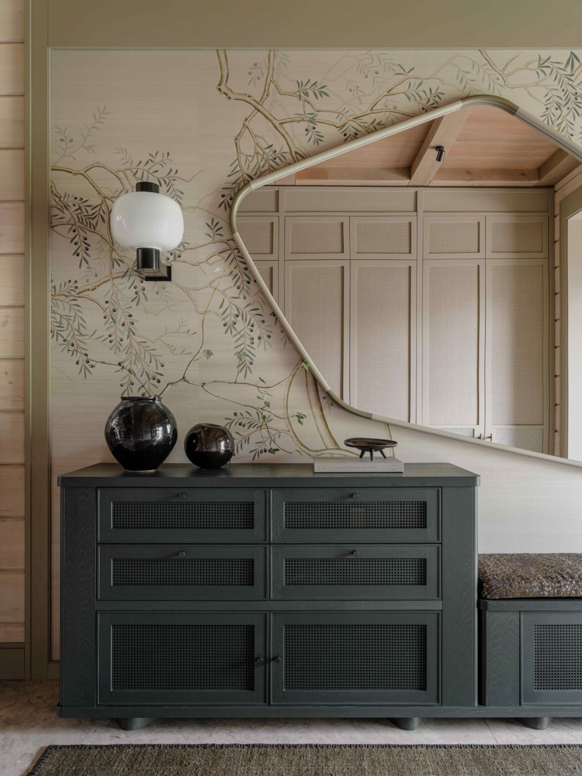 Hand-painted silk wallpaper in the entrance hall evokes an Eastern influence
