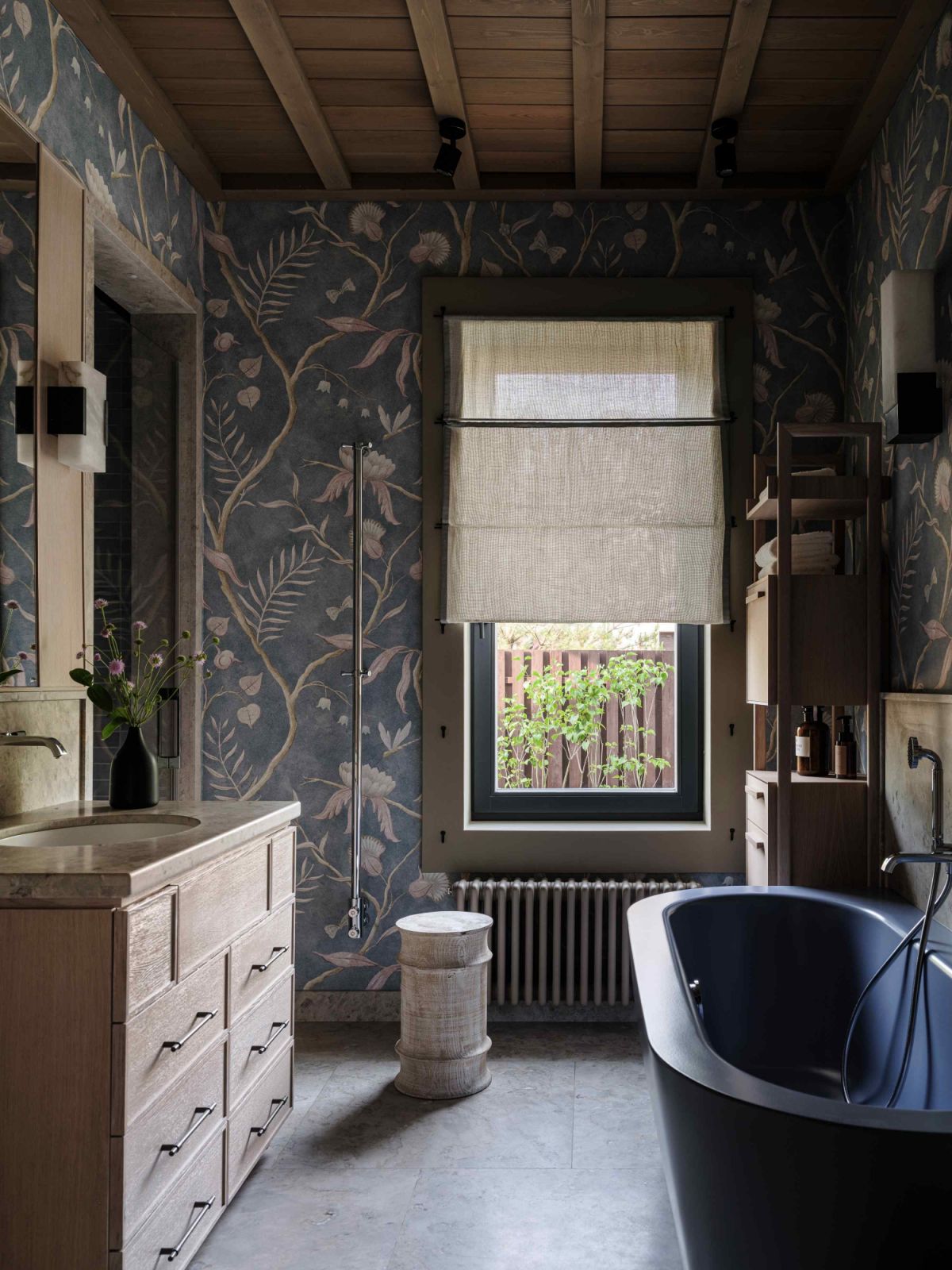 A nature-inspired wallpaper in the master bathroom