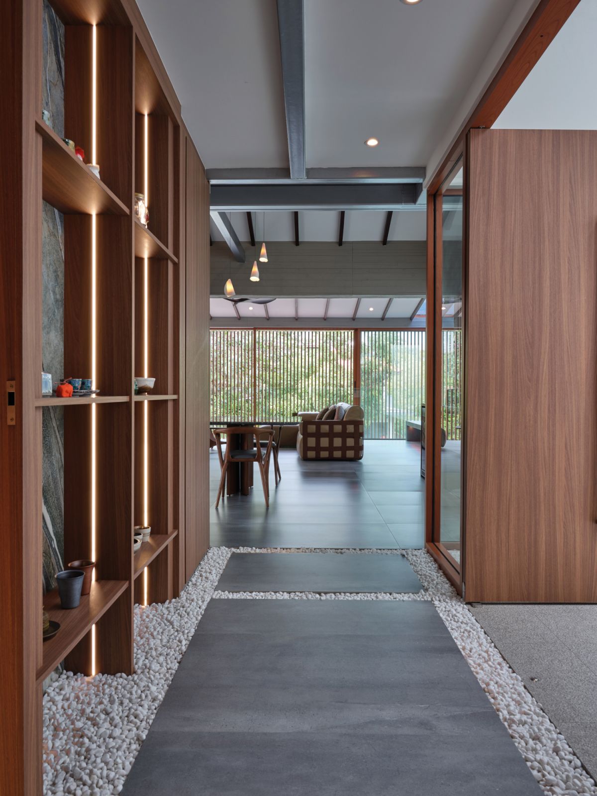 This view of the hallway captures the layered materiality of the restored home