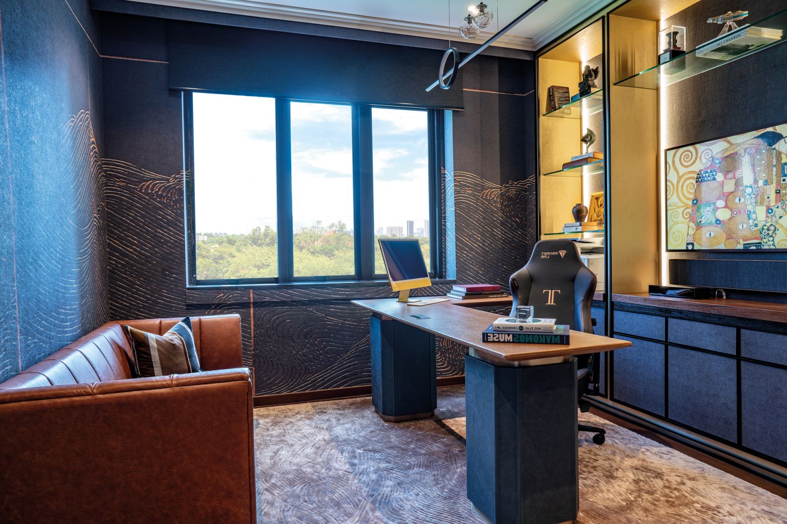The husband’s private sanctuary is a masculine space characterised by dark wood tones and a sumptuous elongated sofa