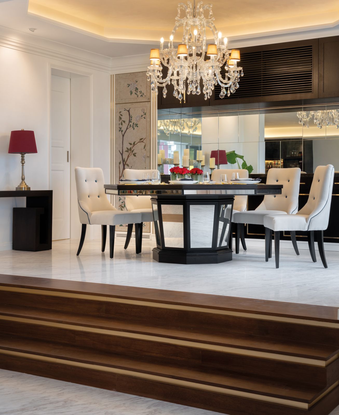 This customised dining table features a tapered base that mirrors the unusual shape of the condominium building