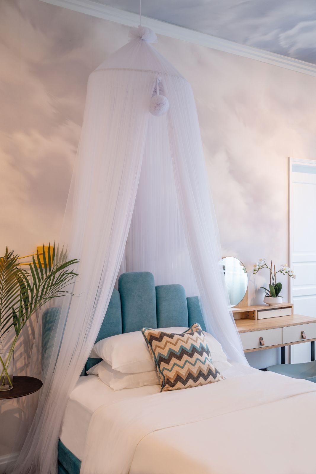 The daughter’s room features a dreamlike vibe and a selection of compact furnishings to accommodate the double bed she requested