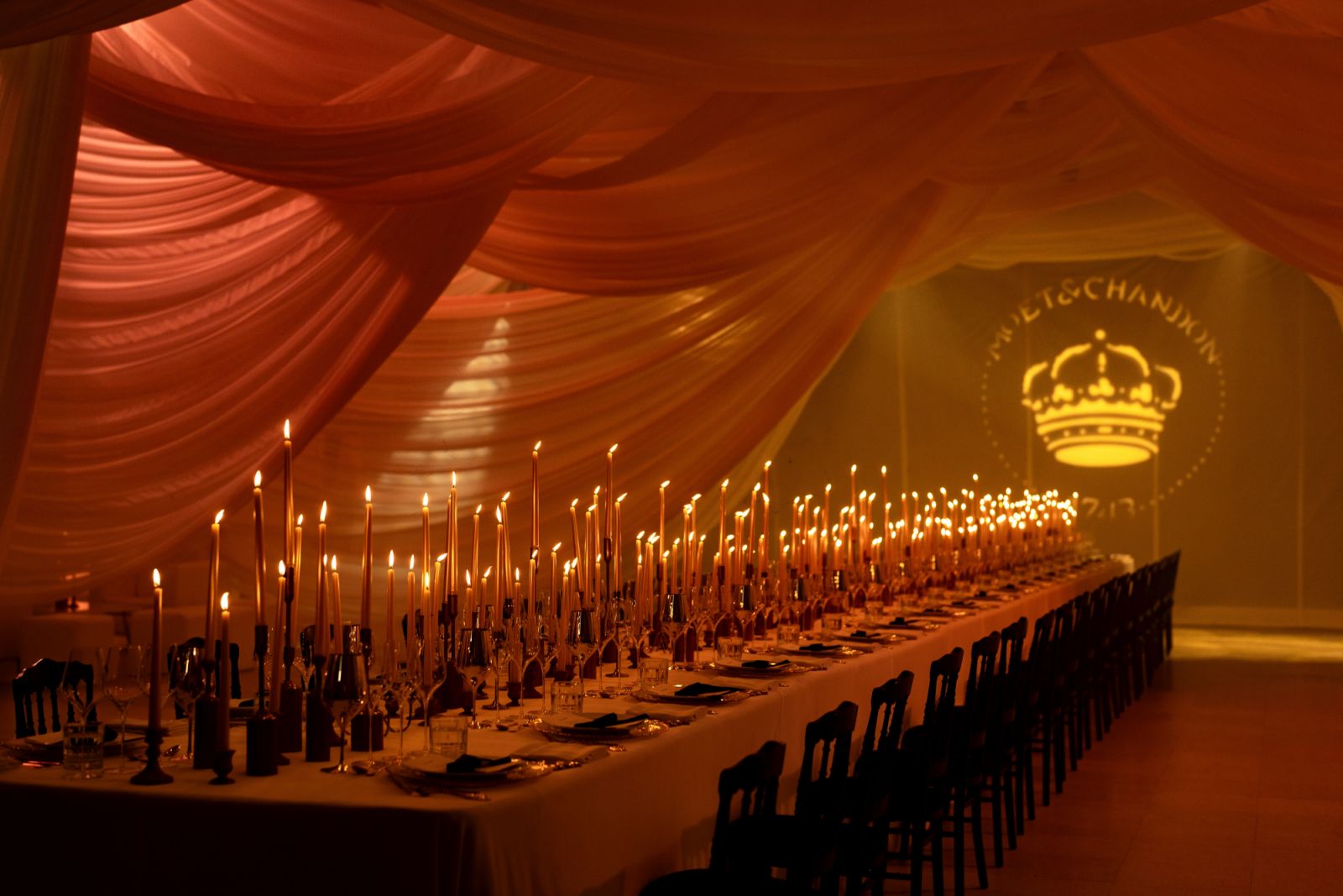 A calm set of candles awaiting for the Moët & Chandon dining experience to commence