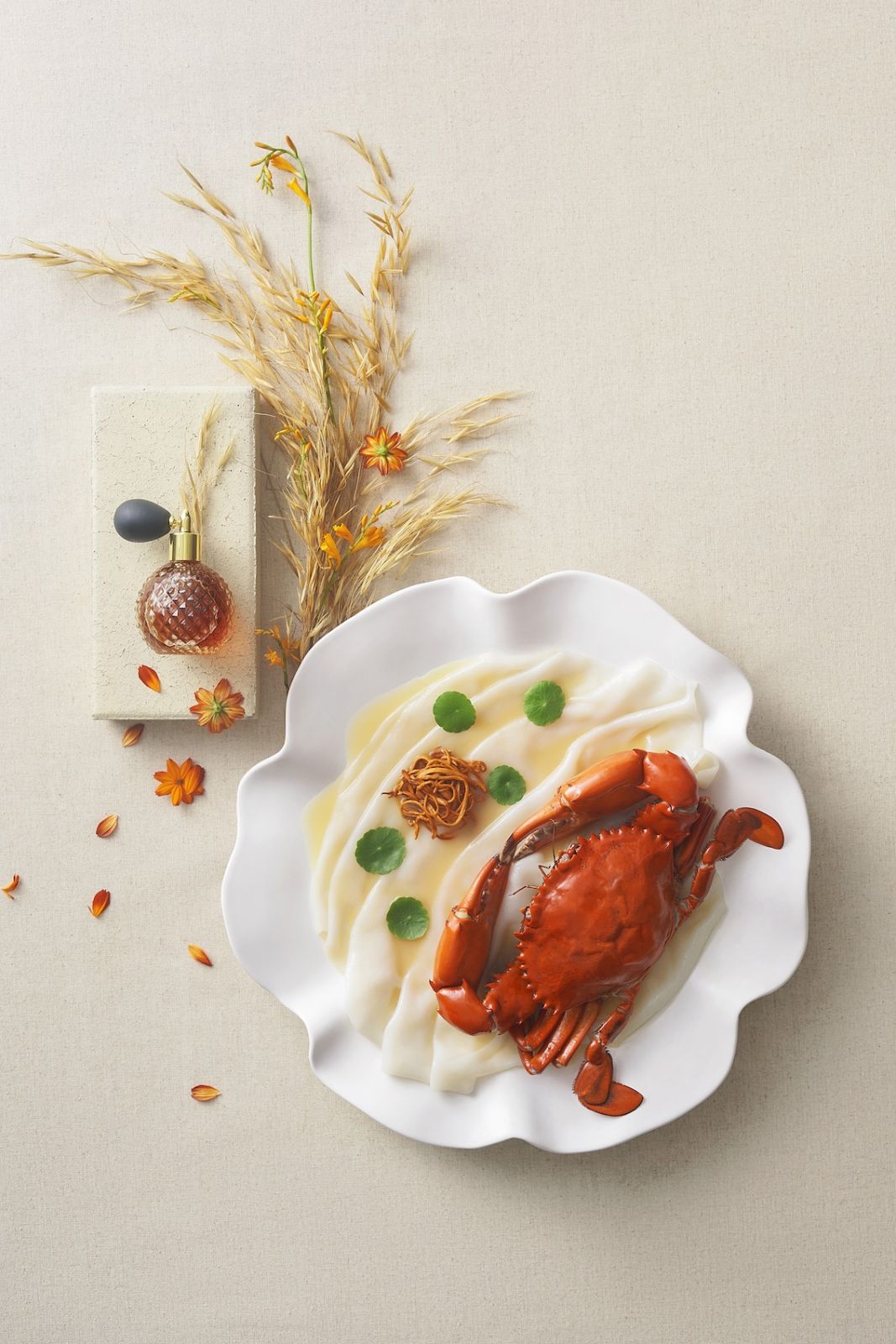 Peach Blossoms' wok-braised rice noodles with whole drunken crab, cordyceps blossoms in Chinese yellow wine