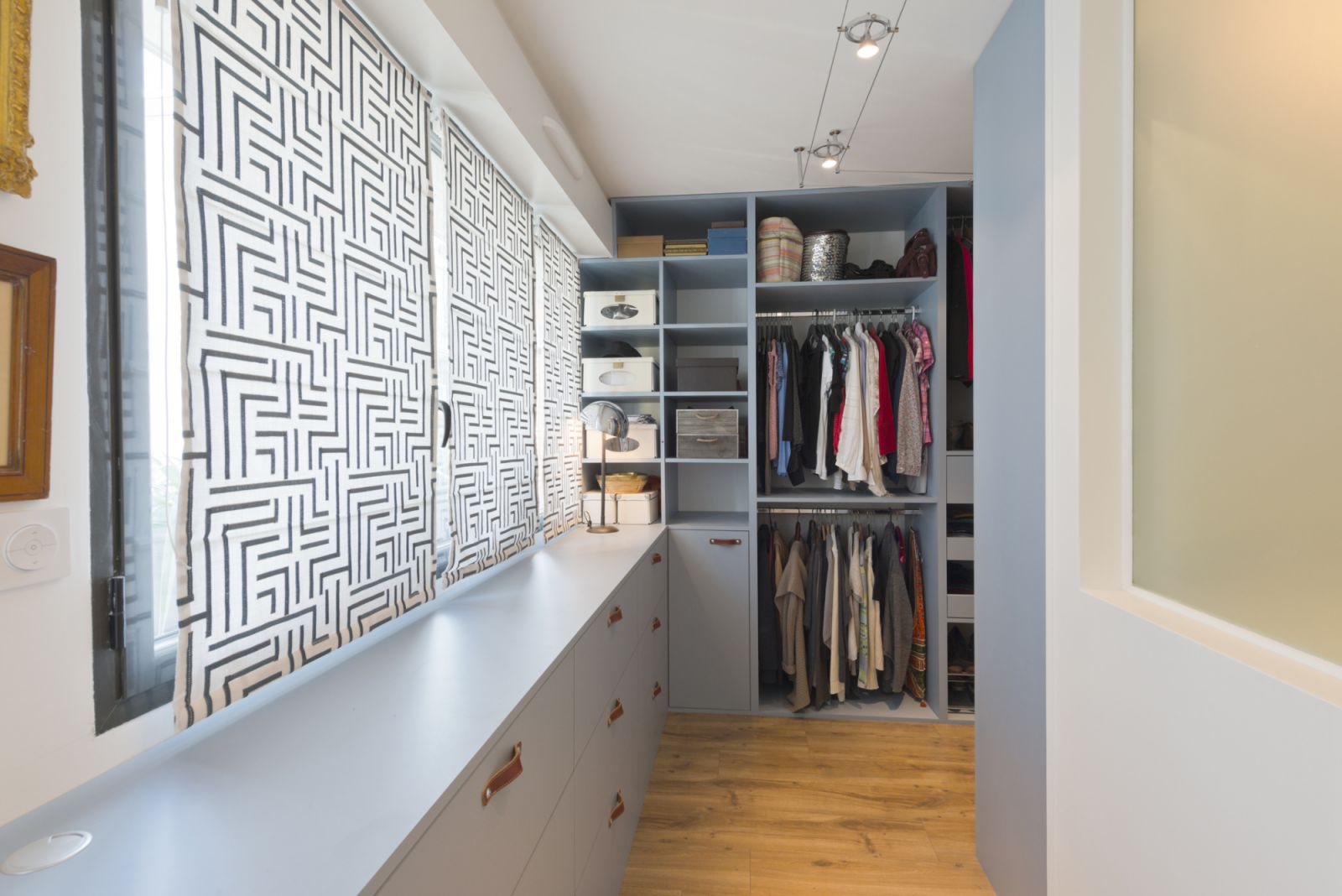 A walk-in closet with compartments for different types of clothes (Photo: Getty Images)