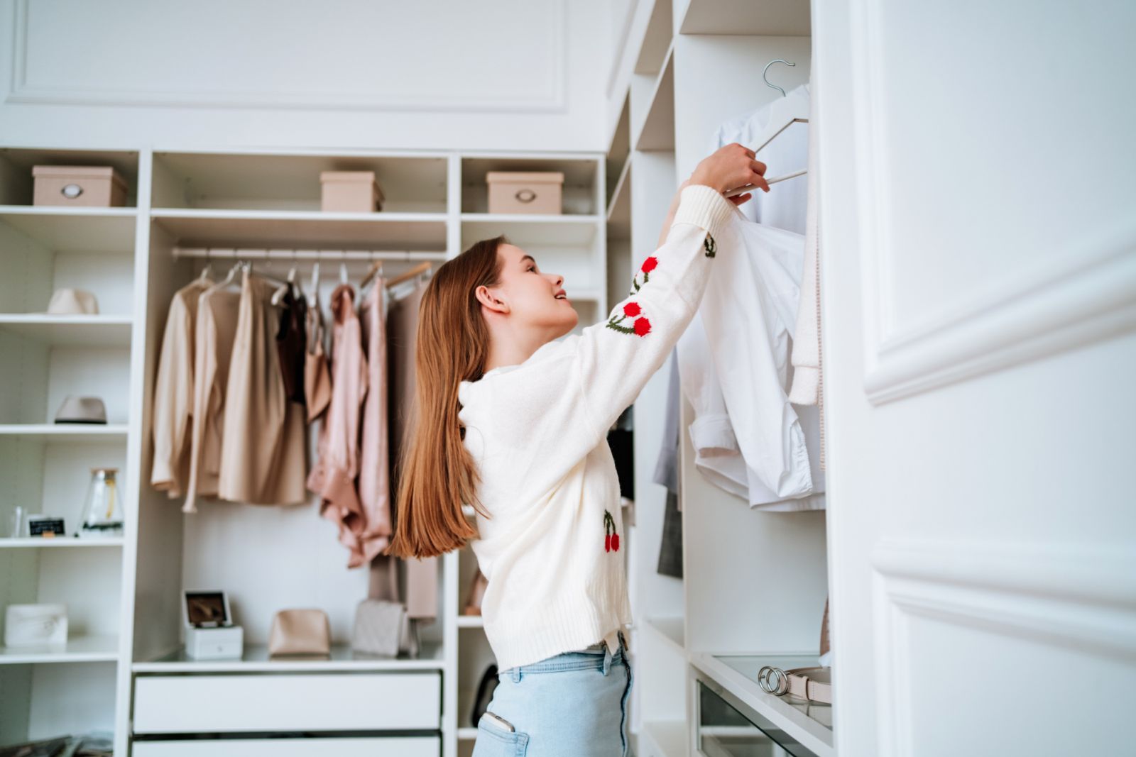 Sorting through clothes in the closet (Photo: Getty Images)