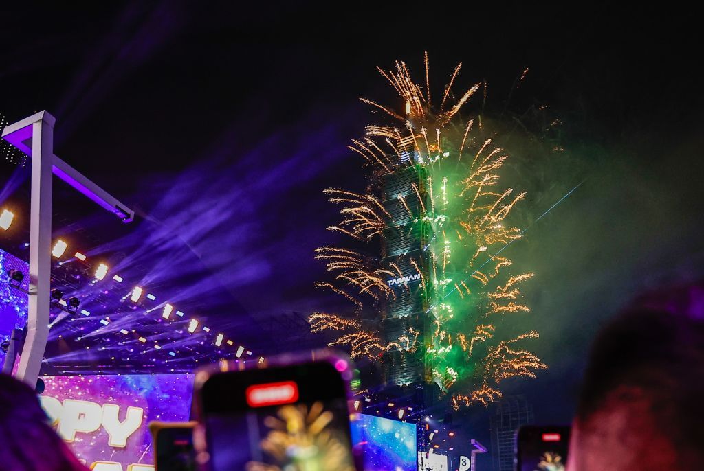 TAIPEI, TAIWAN - JANUARY 01: People watch fireworks released from landmark Taipei 101 to embrace the new year of 2025, in Taipei, Taiwan, on 1 January, 2025. (Photo by Daniel Ceng/Anadolu via Getty Images)