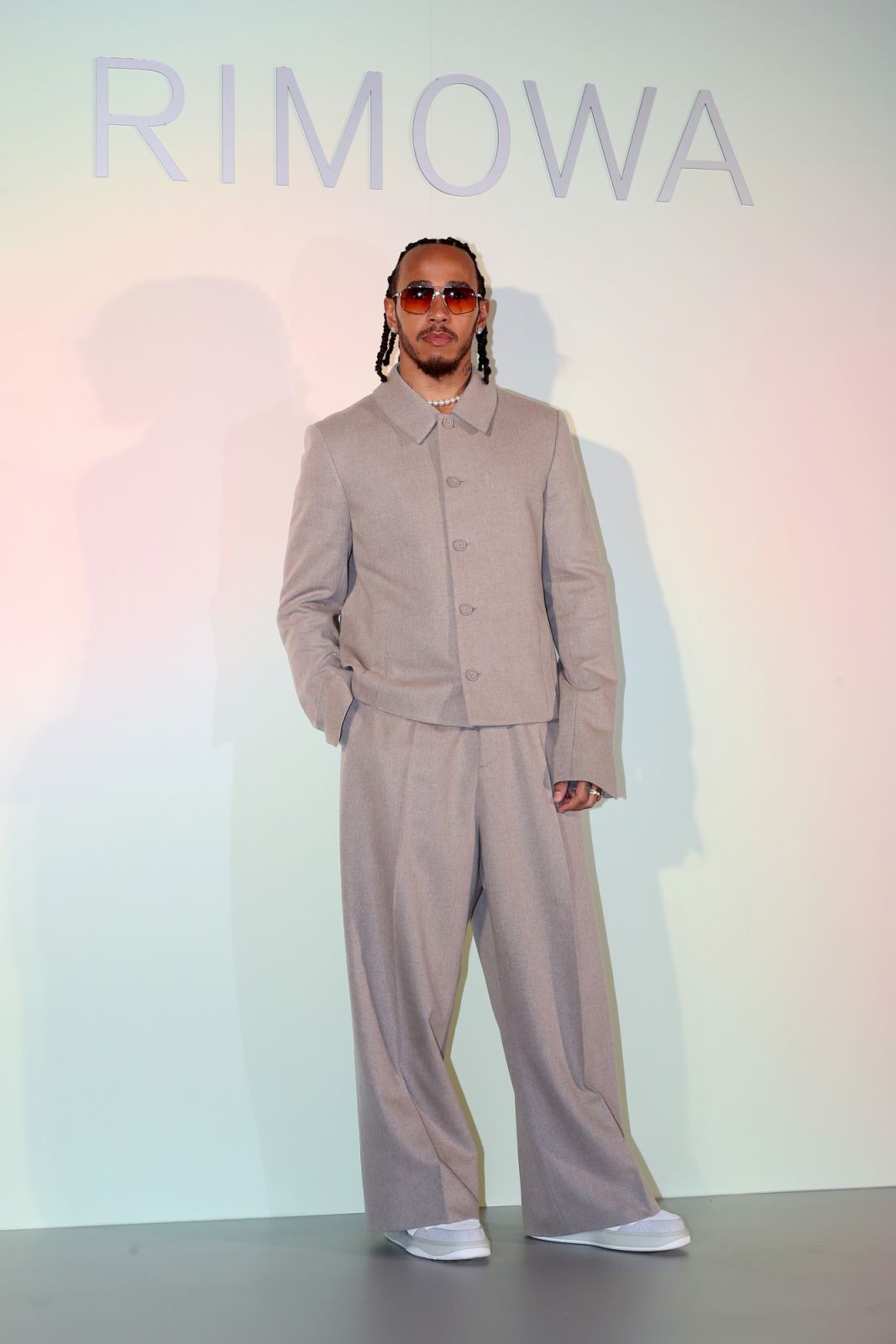 Rimowa brand ambassador, Lewis Hamilton is seen at the RIMOWA 'Mint & Papaya' collection launch photocall (Photo: Getty Images)