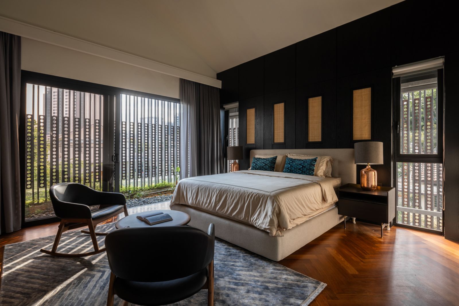 The bedroomsfeatures merbau timber flooring and the signature Chengal screens