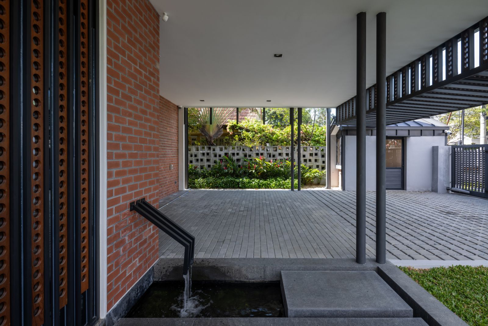 The external entertaining area features a water feature that leads to what Kanny designed as the Hash House Harriers bar,