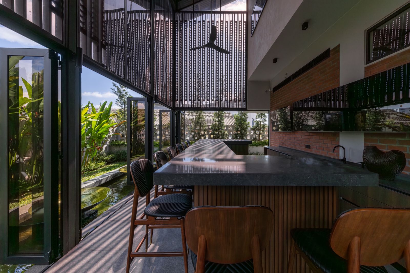 "The double-volume bar space opens to a garden, fulfilling the client's request for an entertaining space accessible from outside