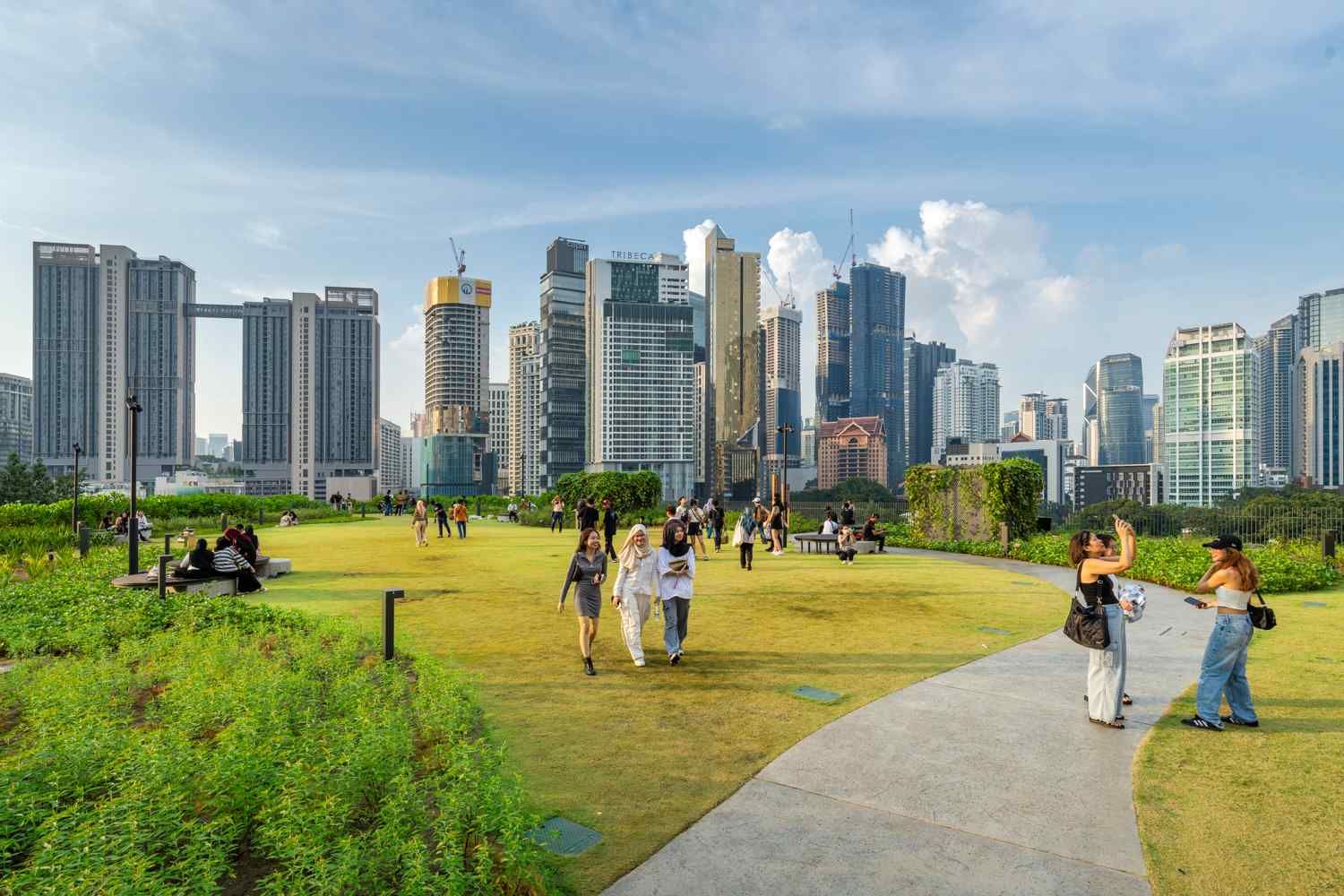 The openness of the lawn space offers stunning views of the city