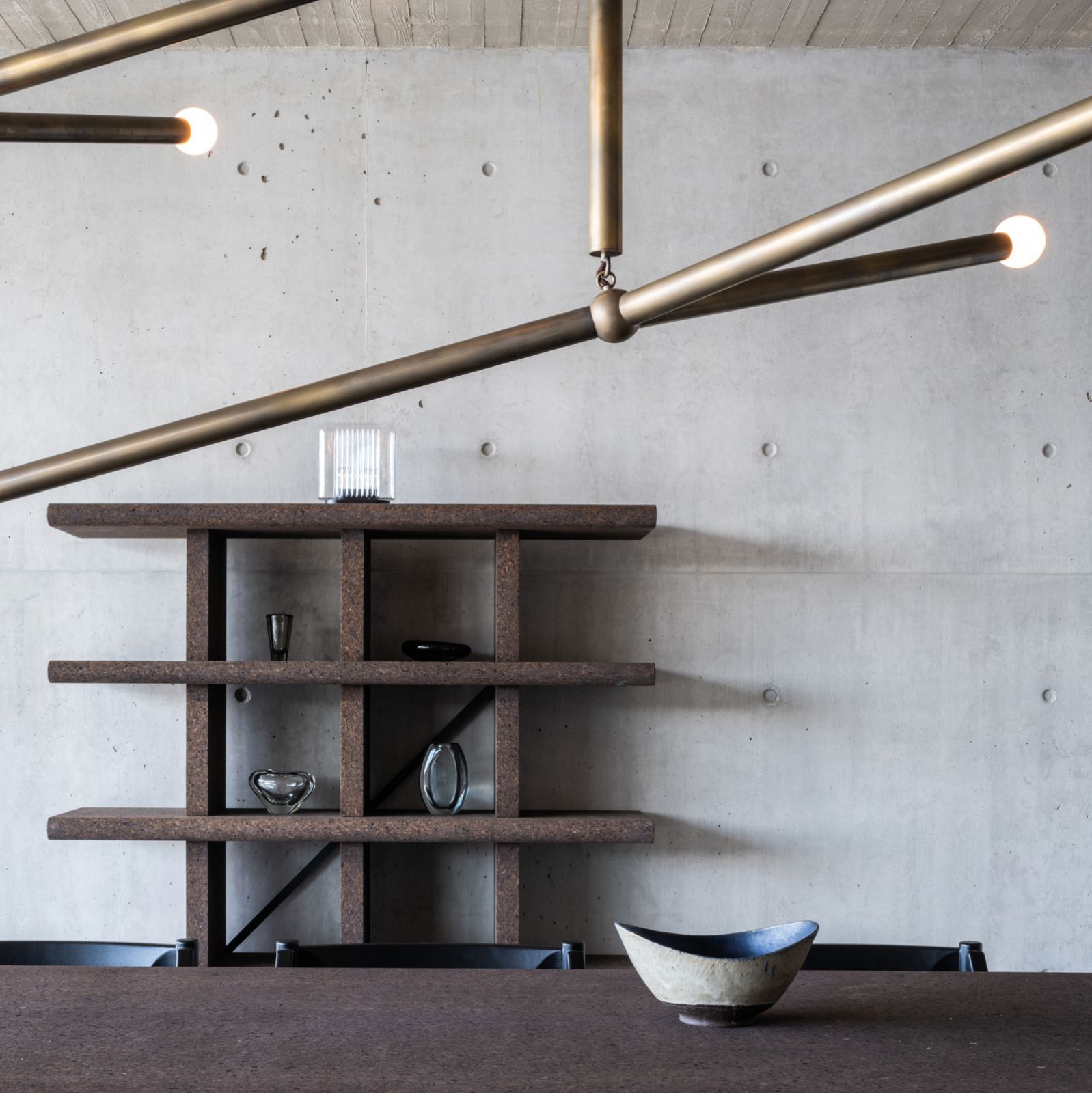 Tom Dixon pieces lend a cohesive aesthetic throughout the villa