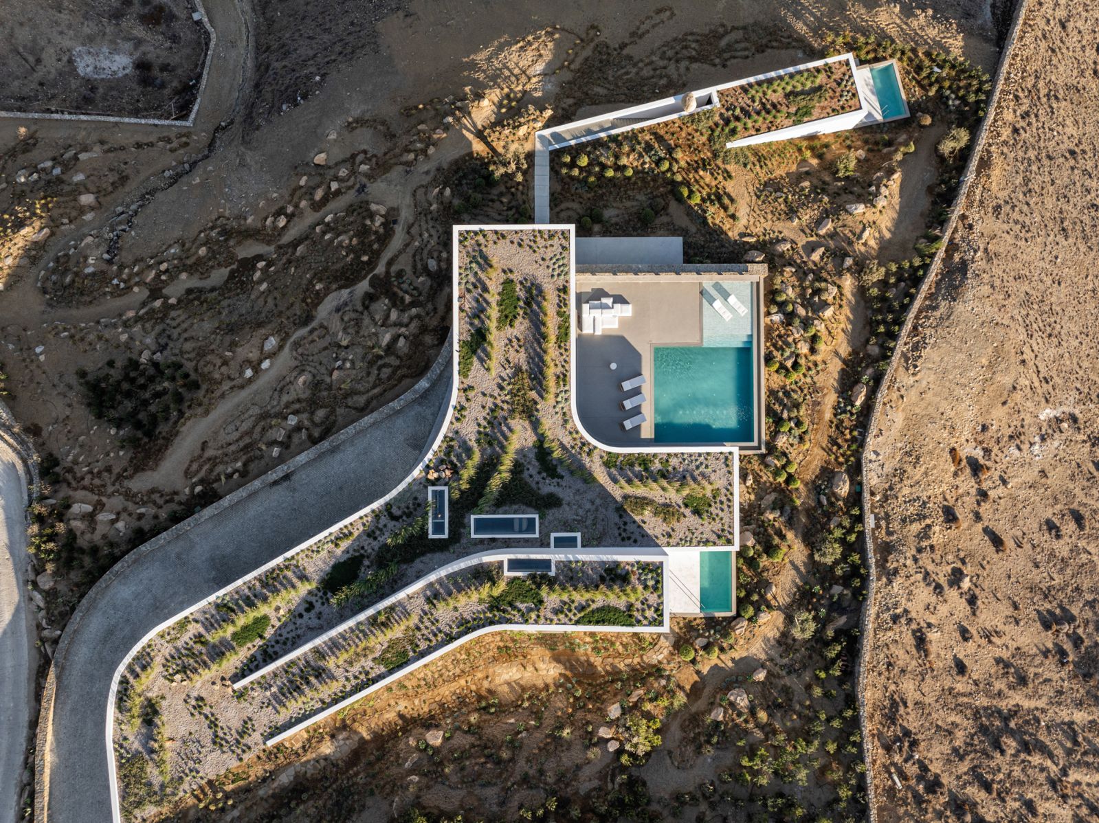An aerial perspective of the property, which seems to merge into the site