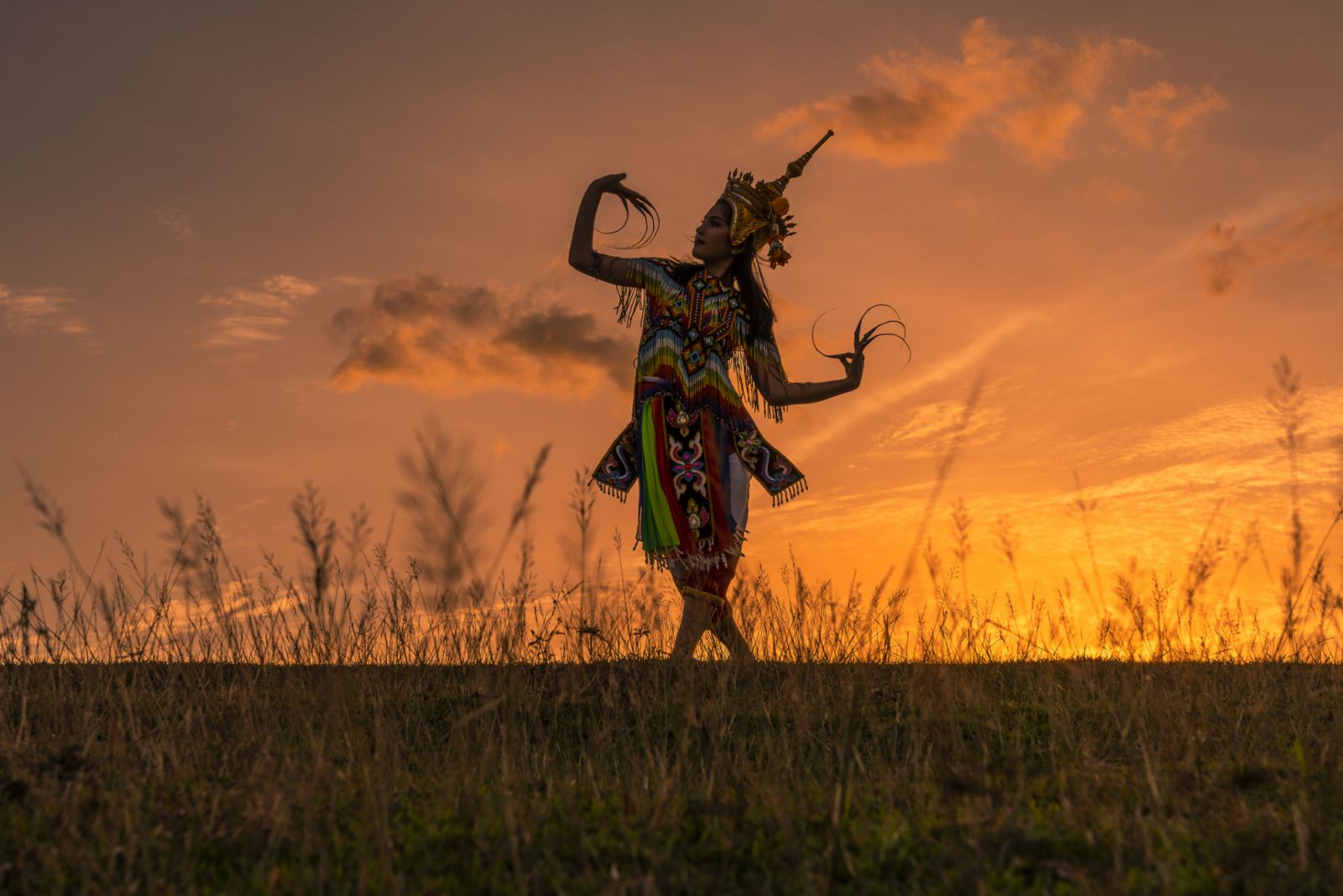 Manorah Thai Southern Traditional Dance againt Sunset Scene, Nakorn Sri Thammarat, Thailand