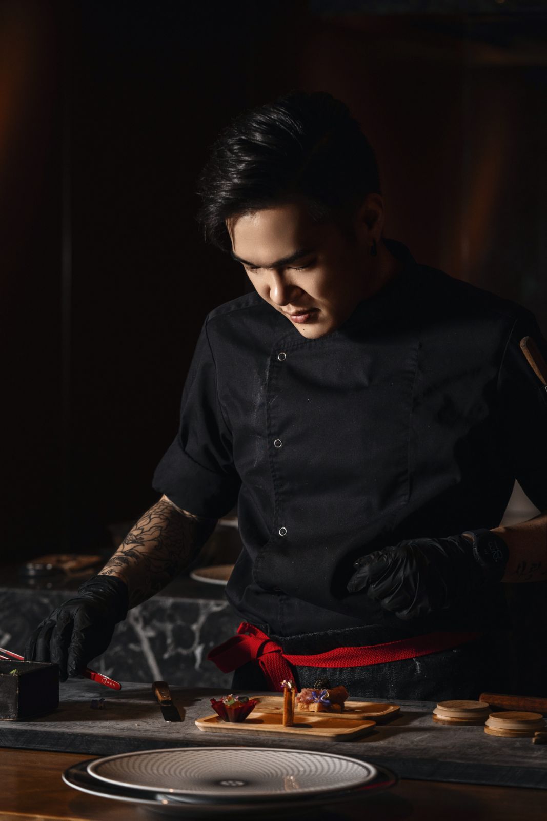 Chef Jordan Yap at his marble counter station, where he meticulously plates each course