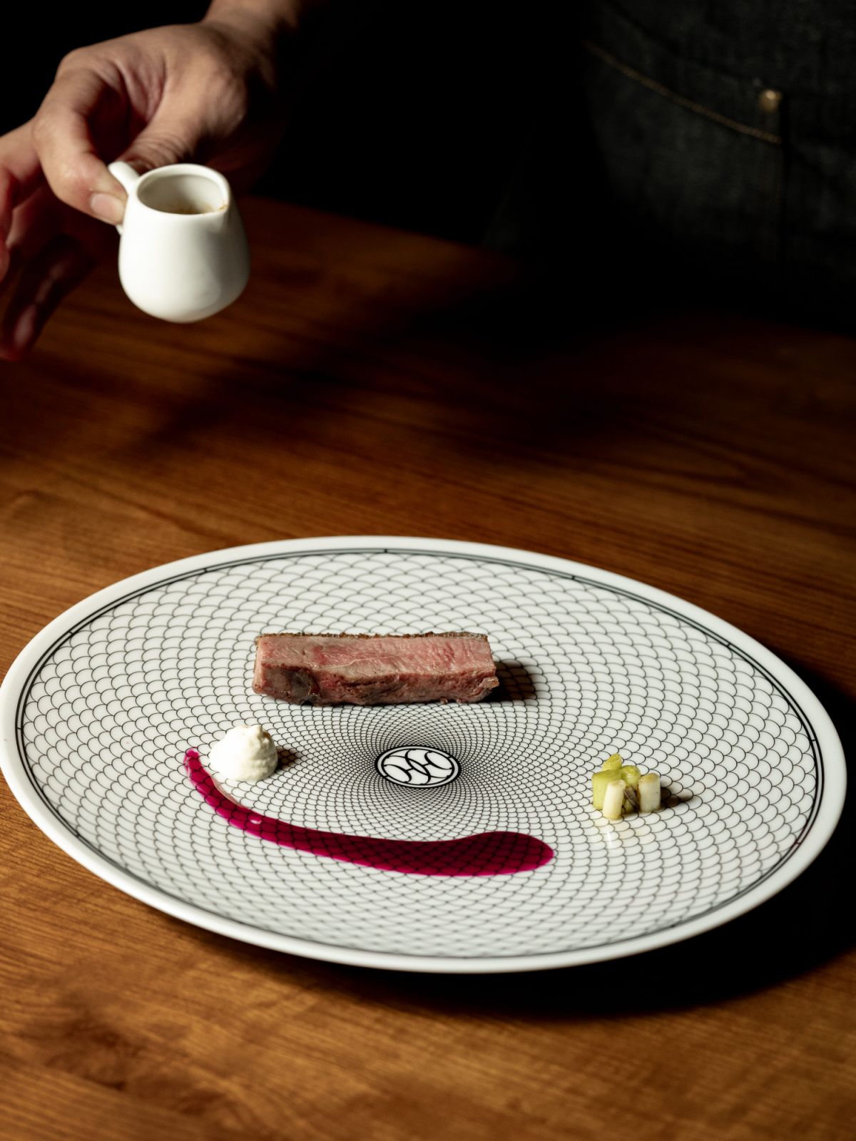14-day dry-aged Irish duck smoked with applewood served on Hermès's signature H Deco collection