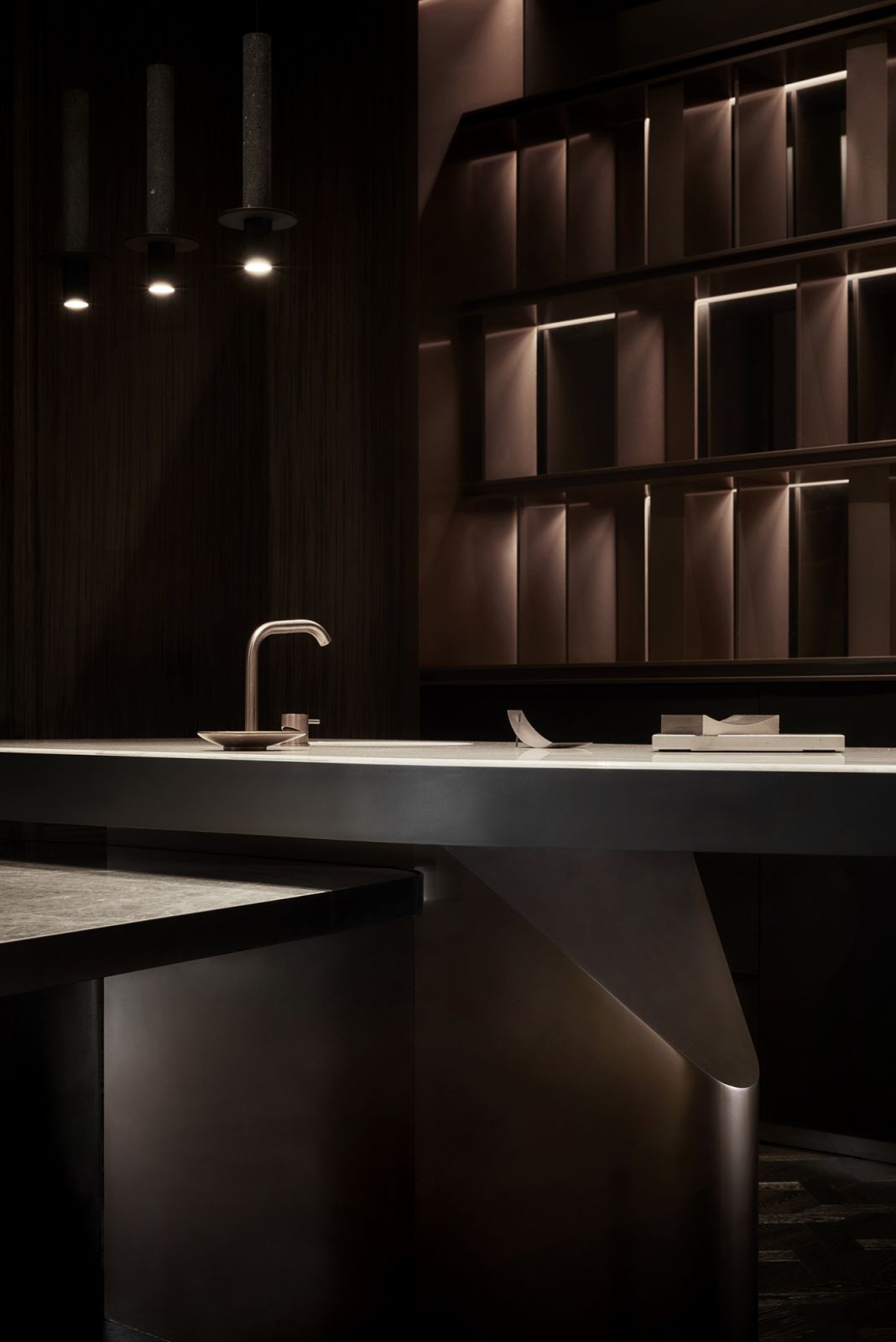 The detail of the kitchen island’s sculptural base