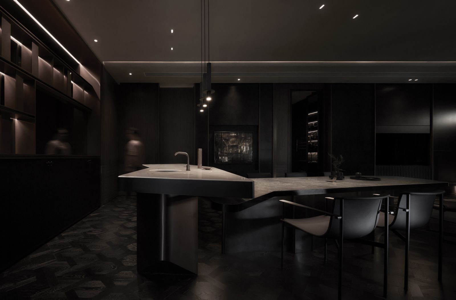 The kitchen island hovers above the dining table, their shapes were inspired by Yabu Pushelberg’s design language for MeyerHouse