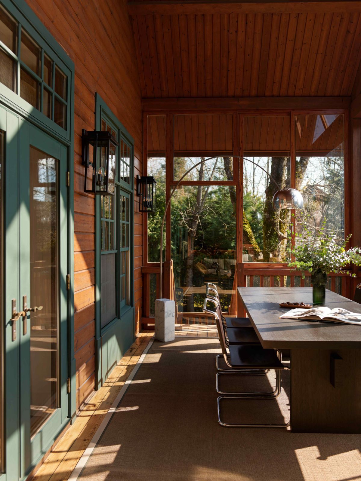 The outdoor dining area with glass-panelled windows