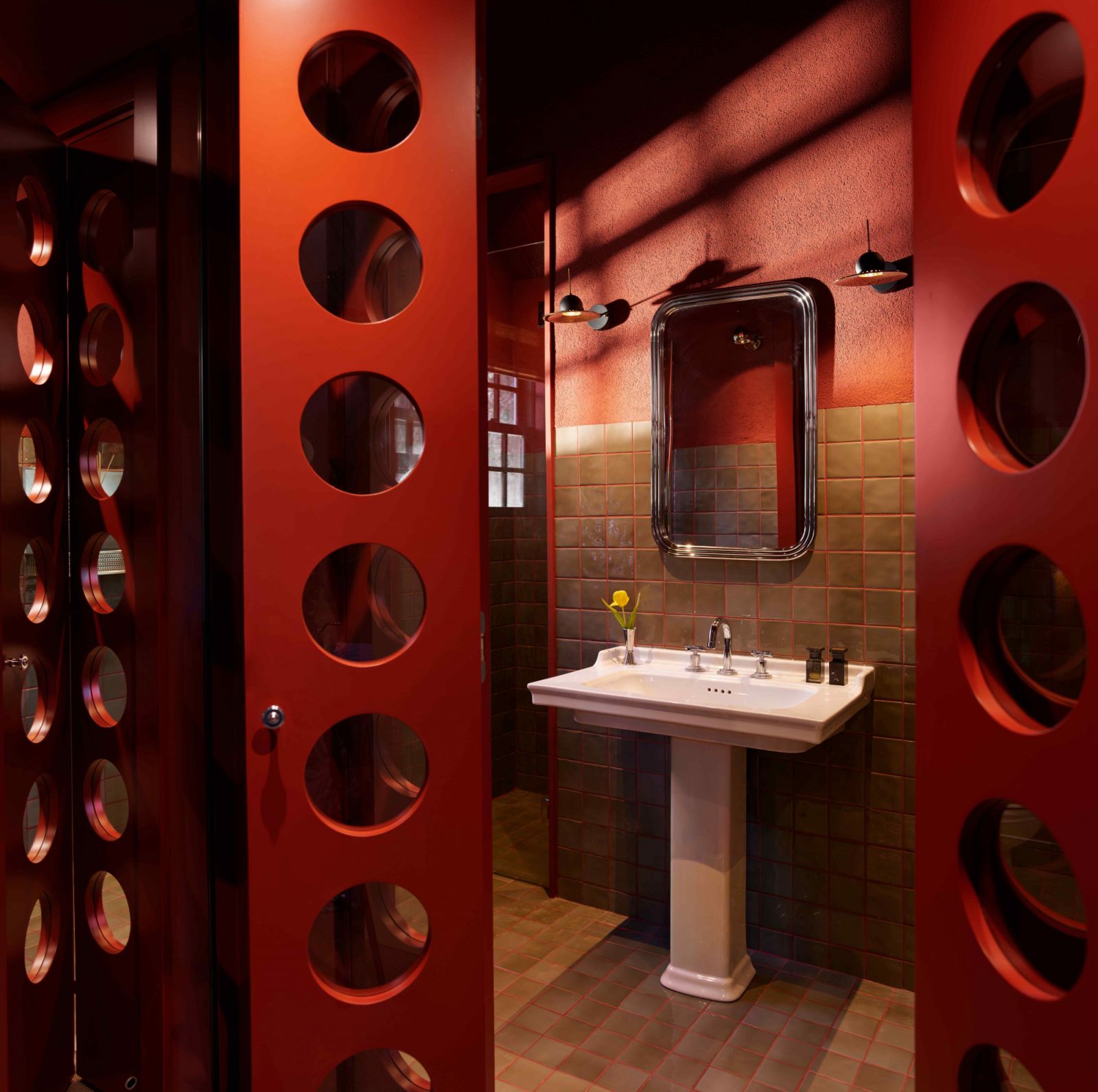 The reflective design of the perforated wood panels