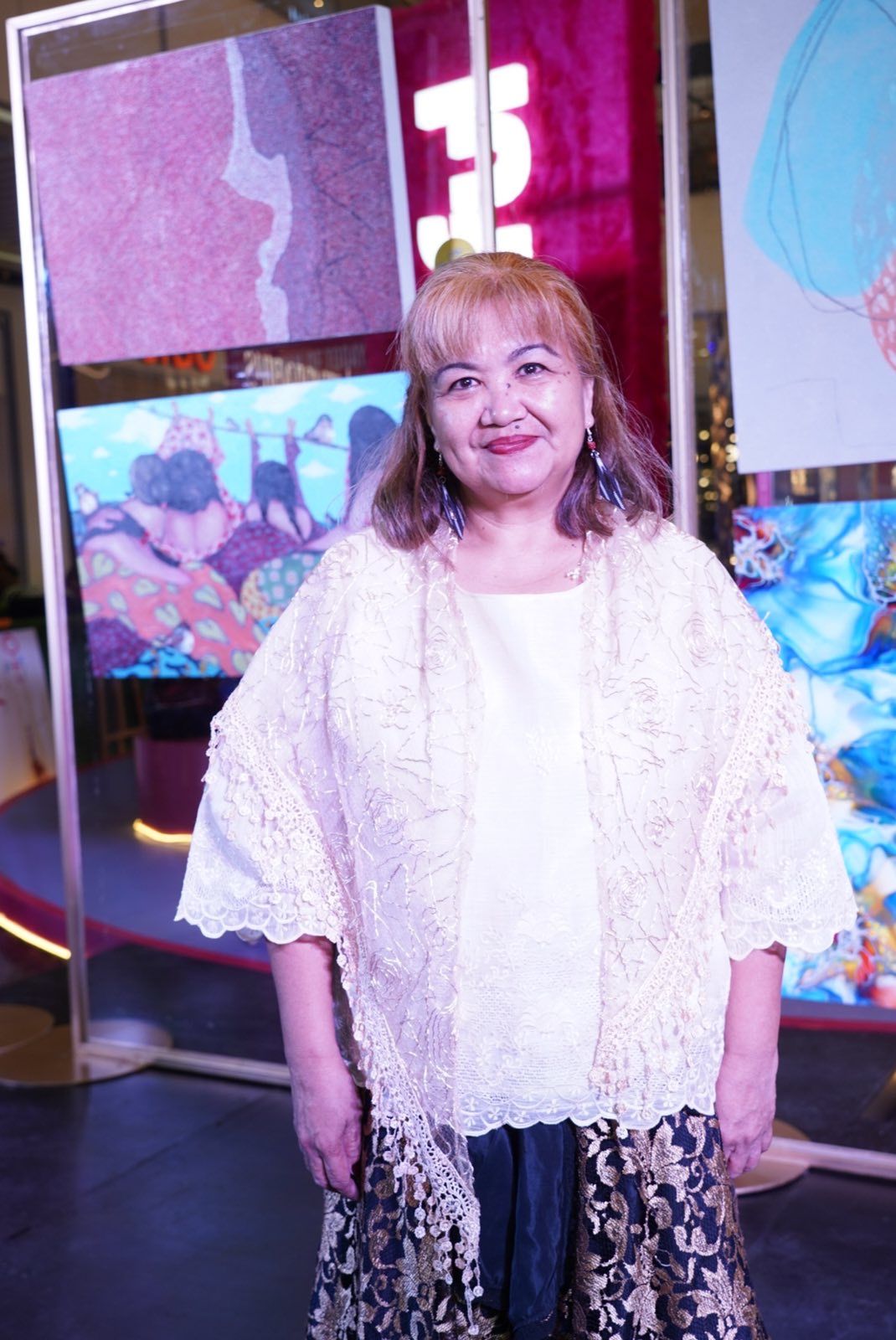 Maria Gemma San Jose from Ilocos Norte and her artwork titled “Layers of Experience” wins top honours in the non-figurative category during last year’s Sining Filipina art competition awarding ceremony at SM Aura (Photo: Courtesy of SM Supermalls)
