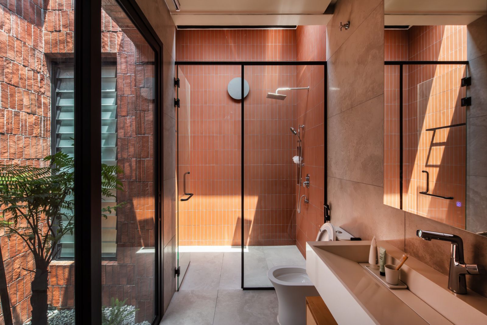 Strategically placed skylights allow natural light into the bathroom (Photo: Ameen Deen)