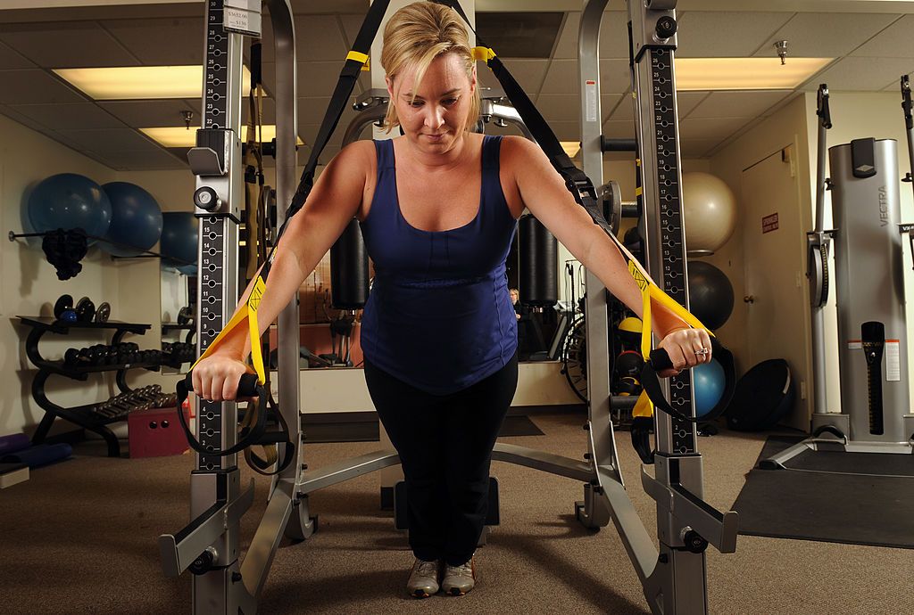 (cm) FE12FTSUSPEND_CM Fitness instructor Anne Parker demonstrates a chest press using the TRX Suspension system at the Healthstyles Equipment at 1555 S. Colorado Blvd on Wednesday, January 7, 2009. Cyrus McCrimmon, The Denver Post (Photo By Cyrus McCrimmon/The Denver Post via Getty Images)