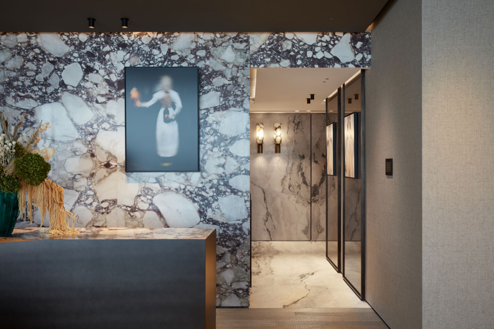 Distinctive marble adding texture to hallways and walls within the apartment