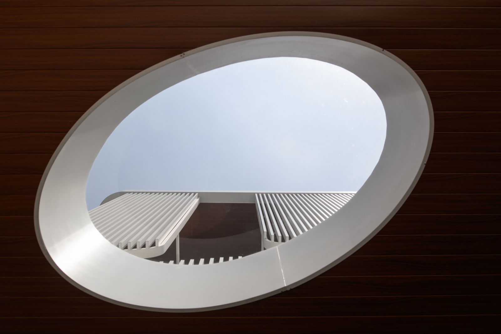 A dramatic elliptical skylight punctuates the distinctive façade