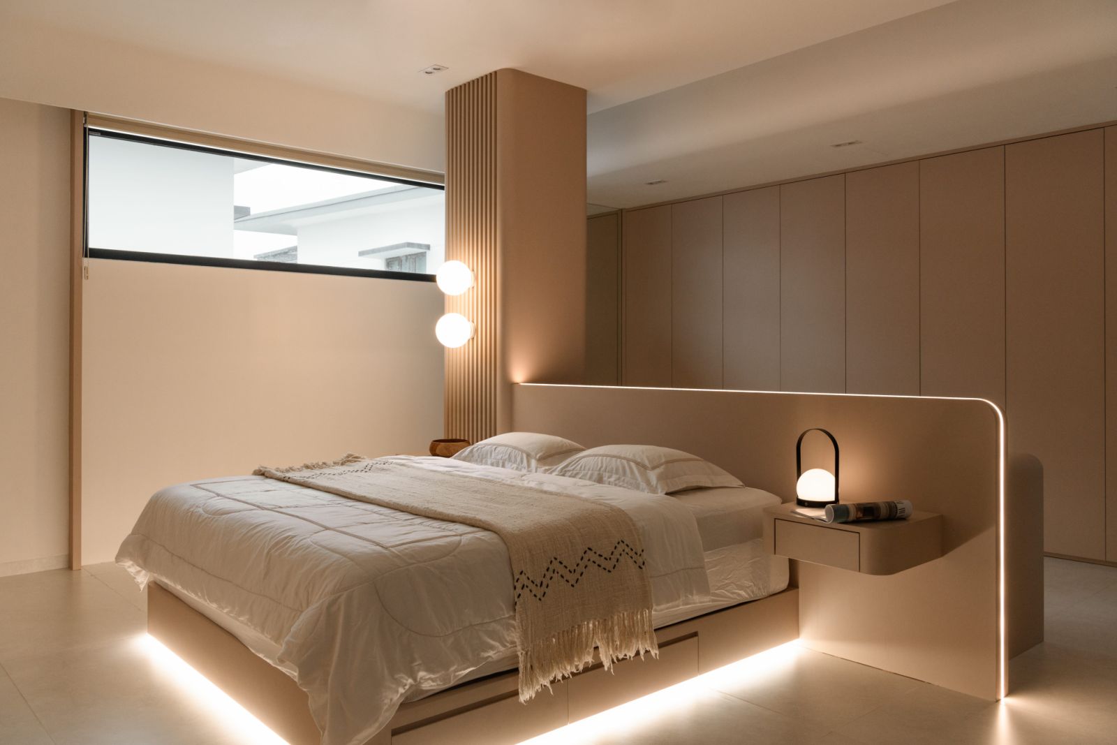 Rippling patterns in the master bedroom create a sense of tranquility, exemplifying the home’s signature curved motif