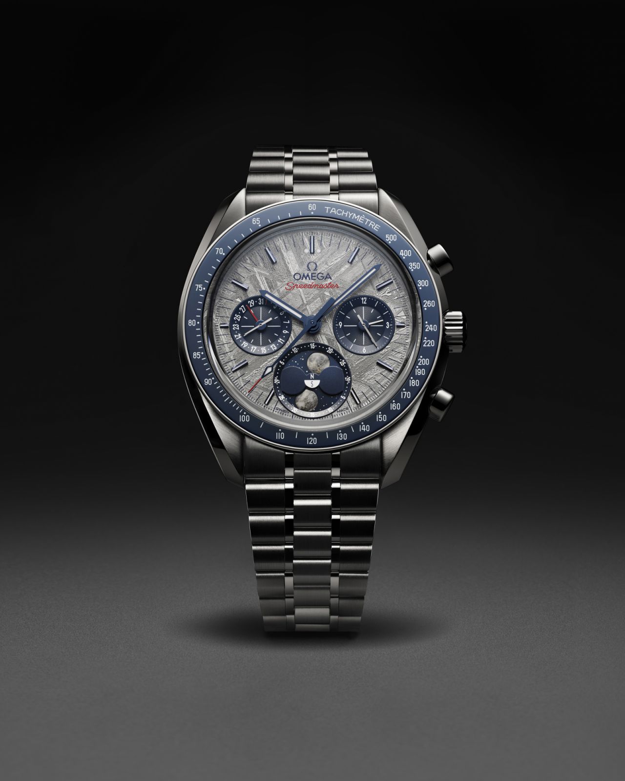 Omega Speedmaster Moonphase Meteorite with galvanic grey-coated meteorite dial on a blue PVD coated base