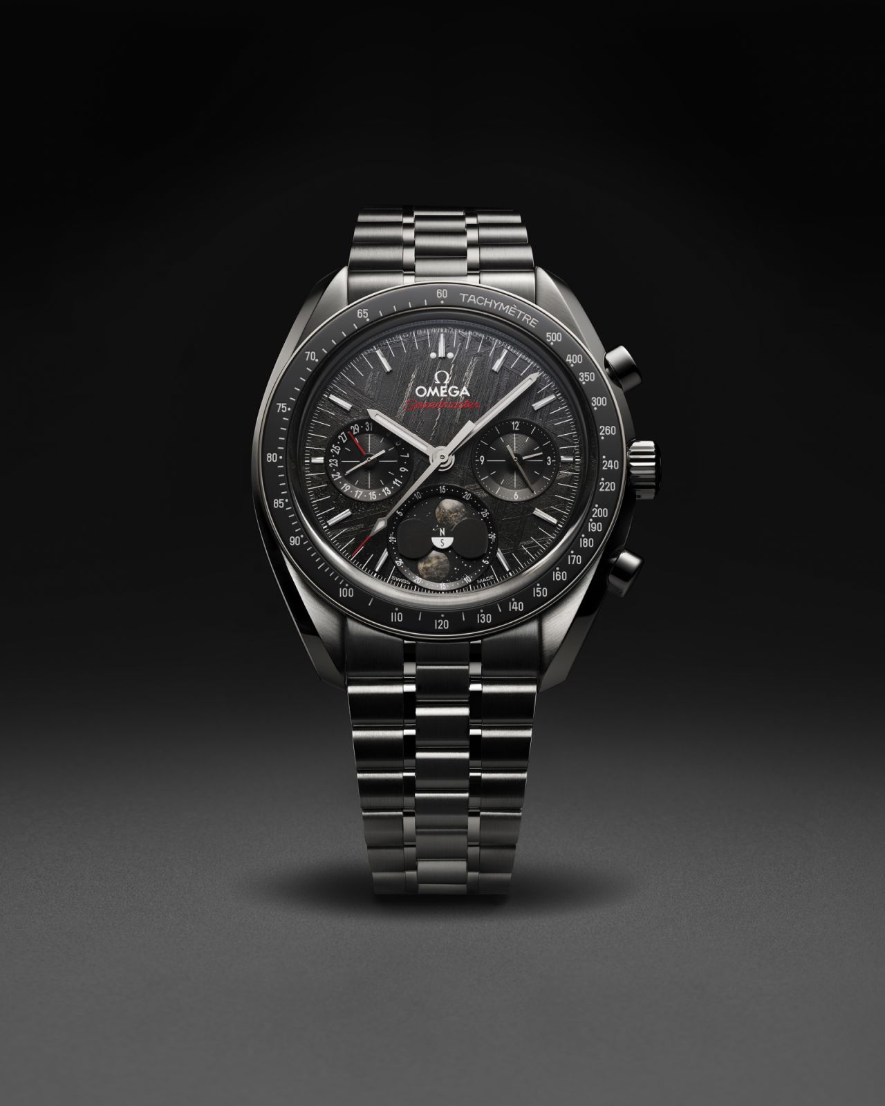 Omega Speedmaster Moonphase Meteorite with black PVD-coated meteorite dial on black PVD coated base