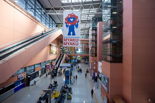 Izumisano, Japan - August 28, 2024 : A banner promoting the 2025 World Expo is hung in Kansai International Airport, Japan.
