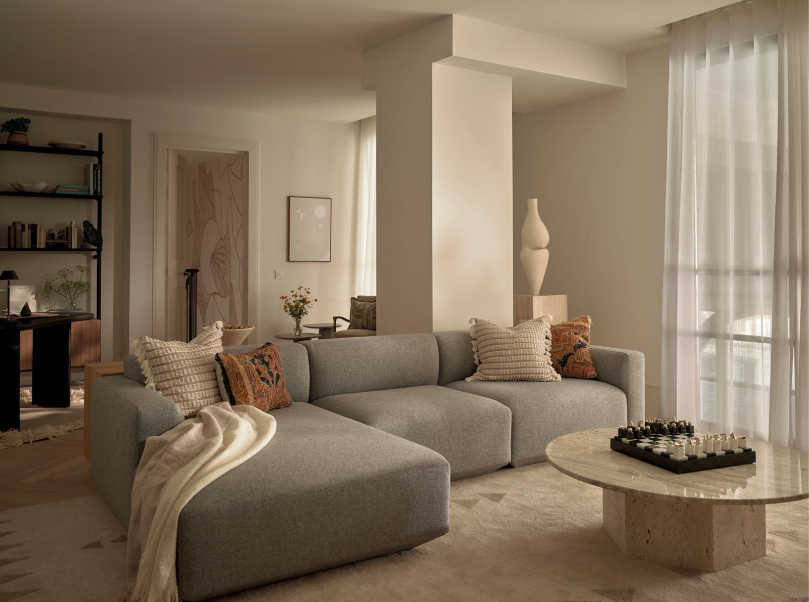 A corner sitting area with a wealth of textures in calming neutral hues