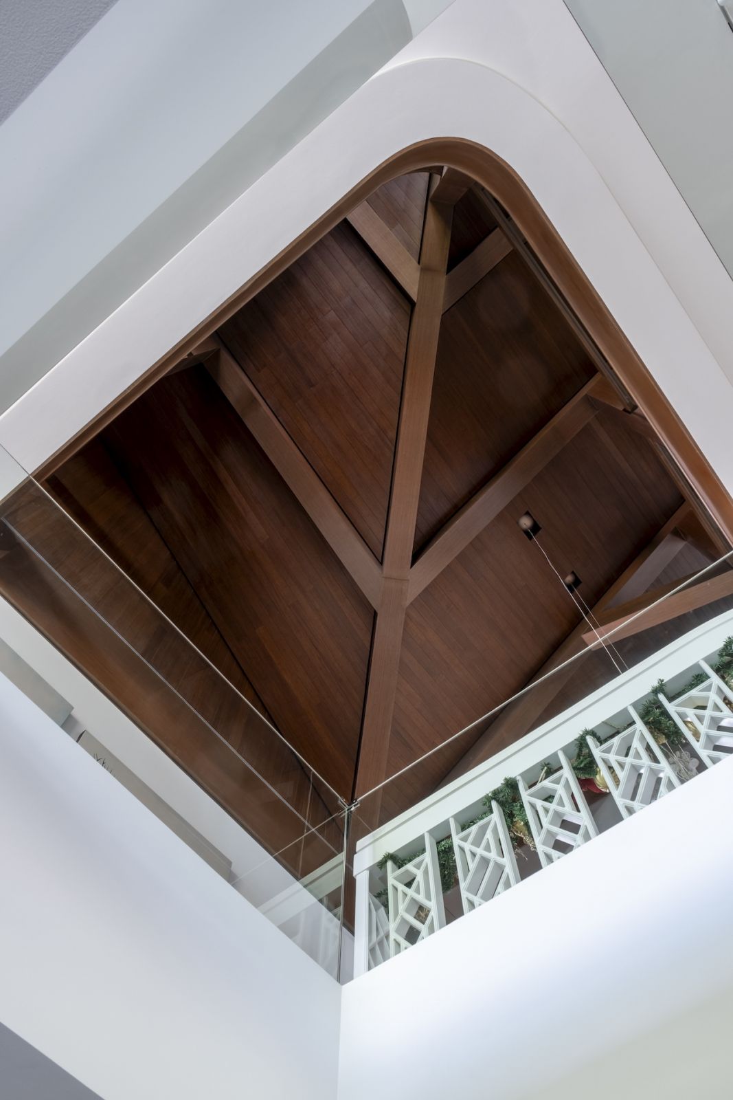 A glimpse of the warm wood rafters from the entryway of the home