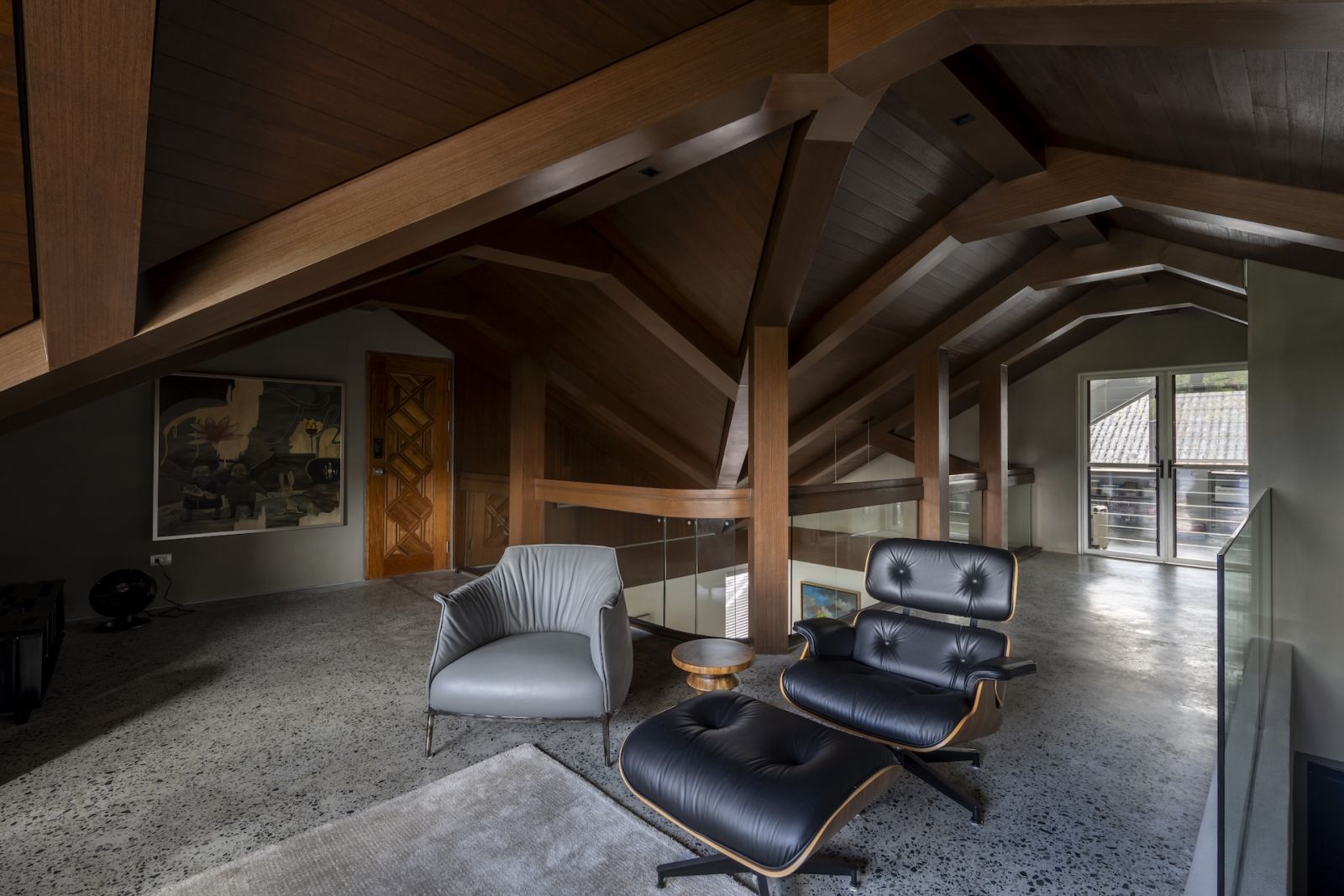 The attic, featuring an Eames lounge chair