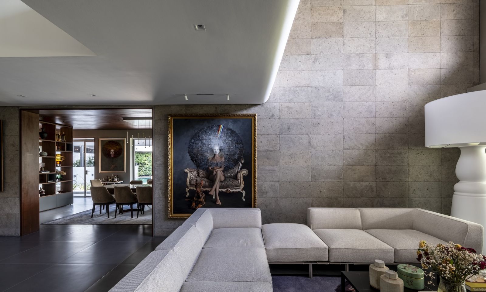 Exploring the unique textures and artworks in the living room, which leads to the dining area and kitchen