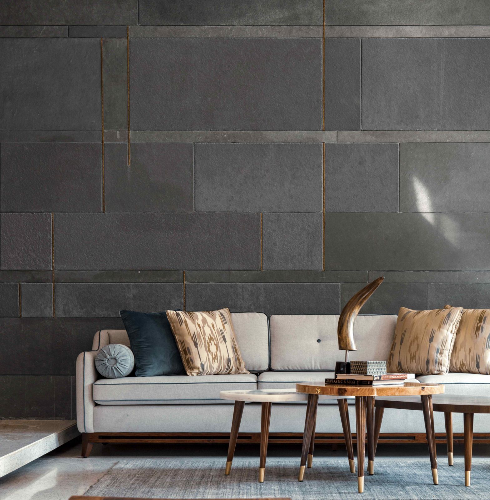 The striking feature wall clad in kota stone in the formal living room