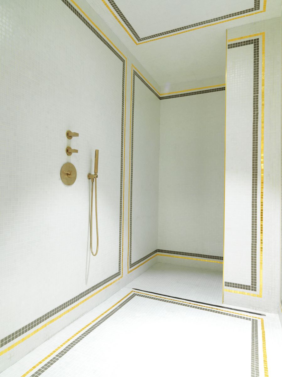 The shower area at Hôtel d’Aubusson feature classic mosaic tiles