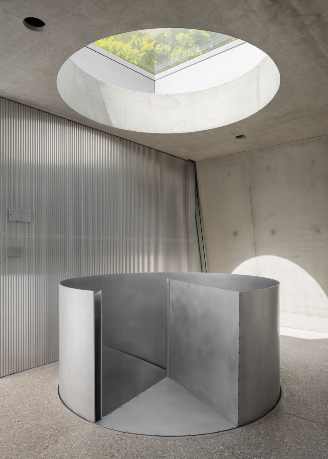 The skylight floods the spiral staircase with natural light and allows for extra ventilation during warmer seasons