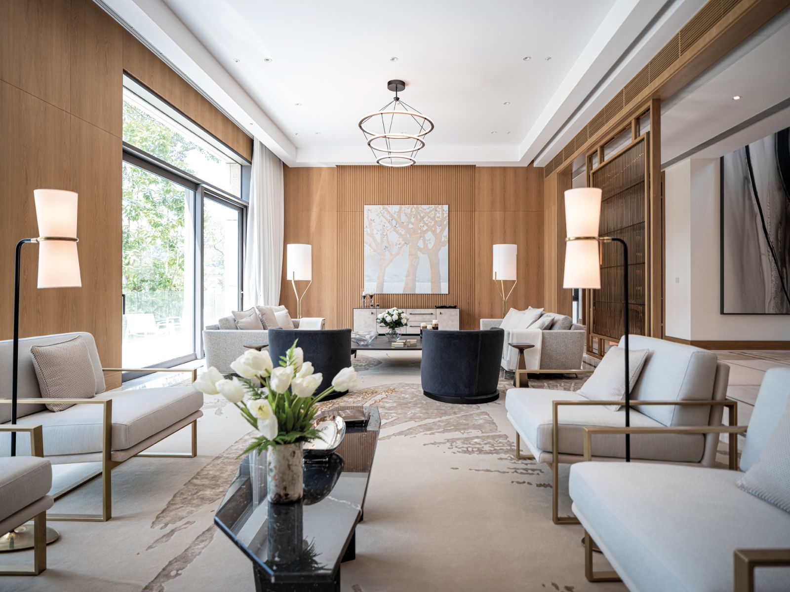 Strategically placed mirrored walls and partitions allow for formal entertaining spaces with nature views at this project by Champalimaud Design in Hong Kong