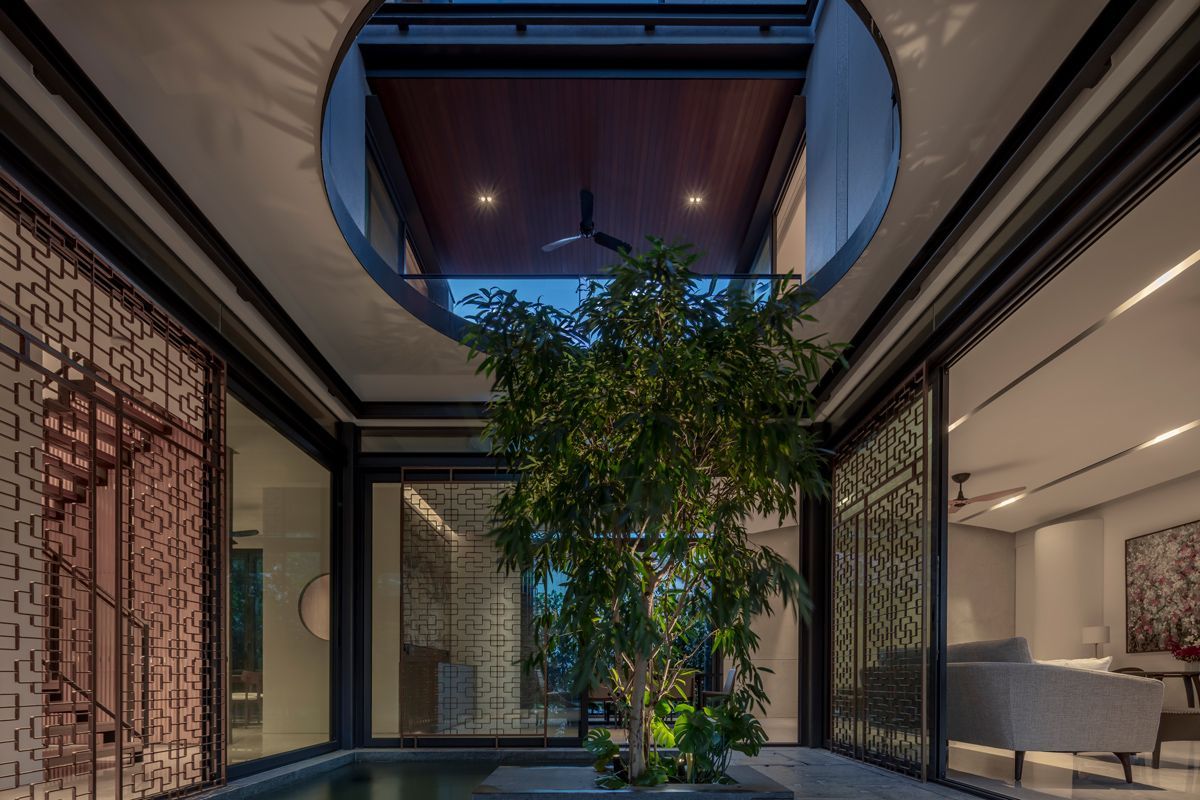 A Ficus longifolia tree lends a poetic touch to the courtyard