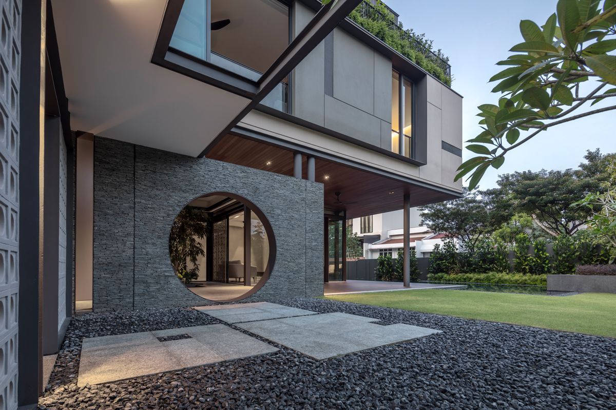 The geometric openings on solid planes lend a distinct look to the house