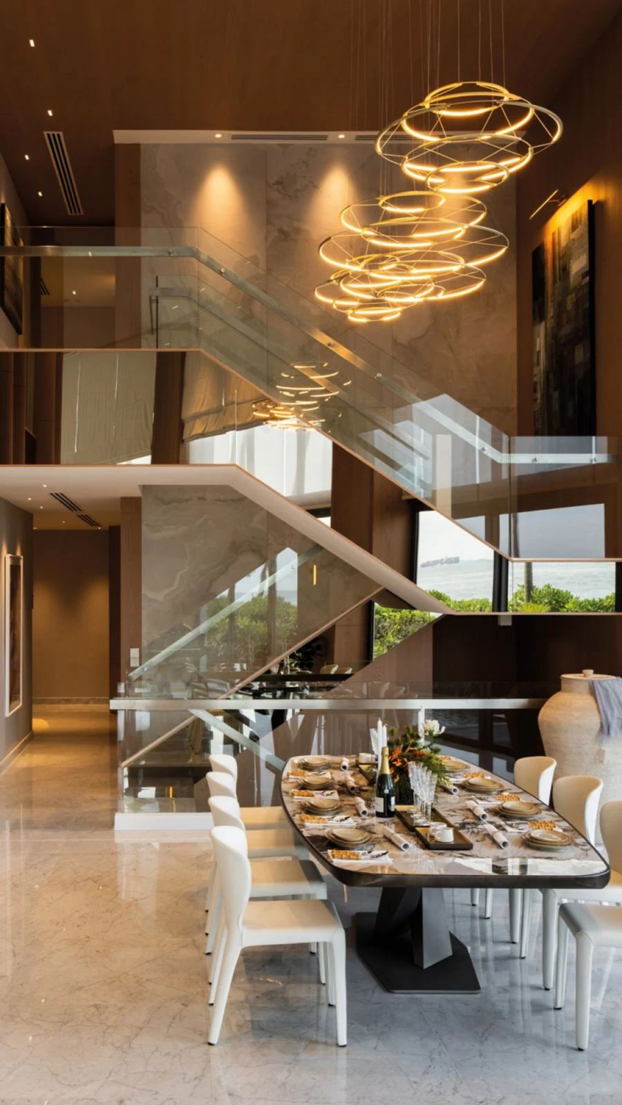 The mirror finish of the staircase amplifies the stateliness of this space