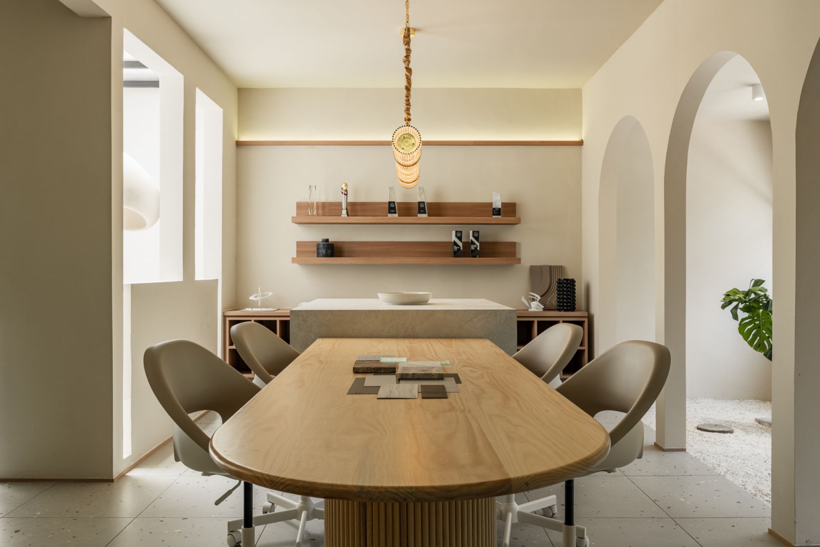 The oval meeting table where the team of ten designers gather for informal brainstorming sessions